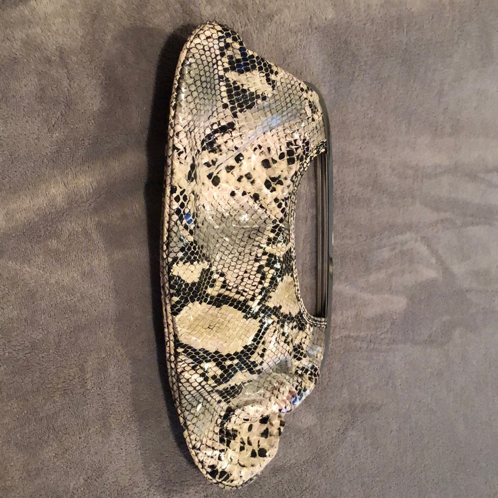 A snakeskin clutch.